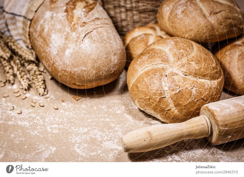 Fresh bread and wheat on a rustic background Food Dough Baked goods Bread Nutrition Eating Breakfast Lunch Dinner Buffet Brunch Organic produce Healthy Eating