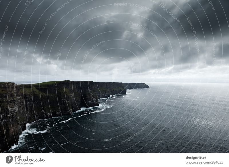defiantly Sky Clouds Storm clouds Climate Bad weather Rock Mountain Waves Coast Bay Ocean Atlantic Ocean Cliff Cliffs of Moher Northern Ireland Europe Threat