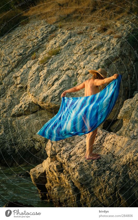 naked young woman stands on a rock and puts a blue cloth around herself Young woman Feminine Summer Naked Free Summer vacation Youth (Young adults) Body 1