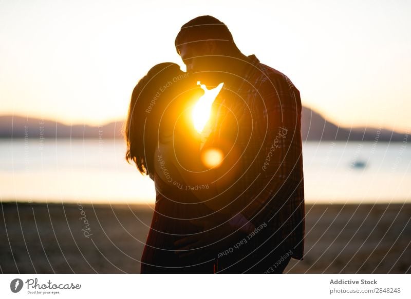 Couple kissing in sunset Silhouette Sunset Lake Kissing Love Nature Woman Man Happy Happiness Human being Romance Beautiful romantic Relationship Sunrise Beach