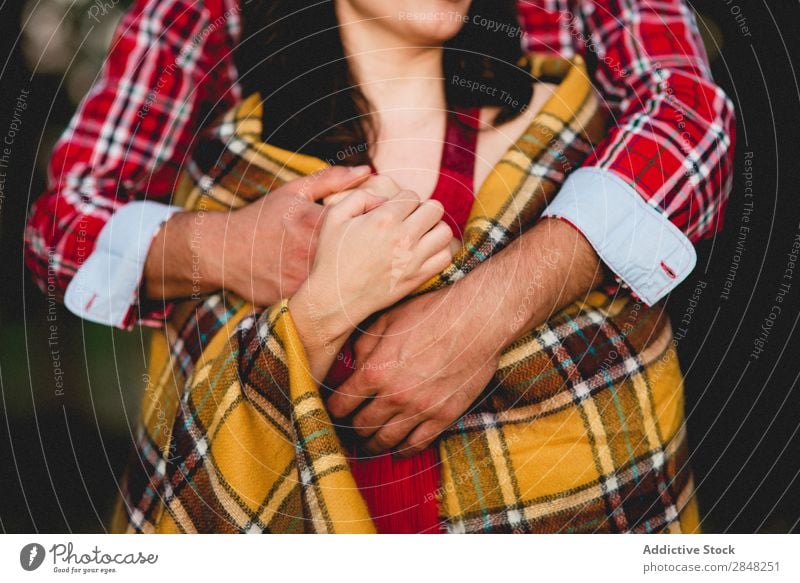 Couple embracing in plaid Checkered Cover Considerate Man Woman Love Family & Relations 2 Together girlfriend boyfriend Human being Romance Relationship Embrace
