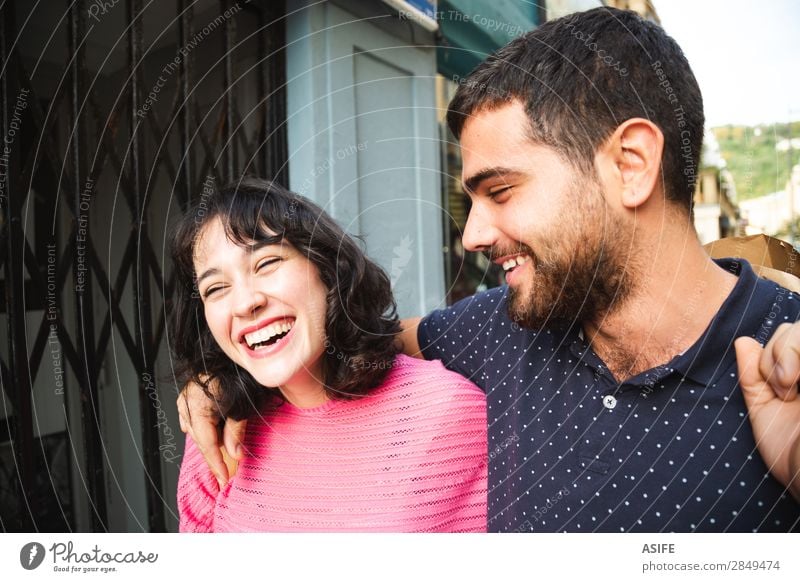 Laughing couple on the street Lifestyle Shopping Joy Happy Beautiful Summer Hiking Woman Adults Man Friendship Couple Street T-shirt Sweater Beard Smiling