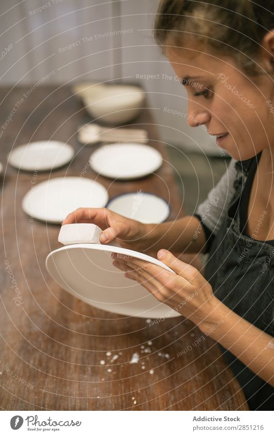 Woman working with clay plates Workshop Crockery handwork ceramics Professional Make craftsmanship Enamel Clay Handicraft clay ware Work and employment creating