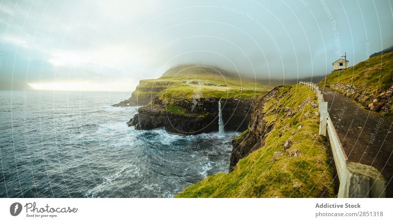 Rocky coast with pathway running on top Landscape Coast Fog Cliff Ocean scenery seascape Tourism Vacation & Travel Tourist Vantage point Mountain Nature Freedom