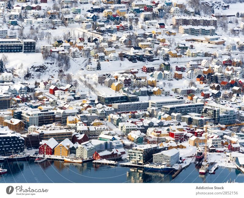 Colorful houses in winter town Coast Lake Stone Mountain Winter City Bridge Snow Cold Frost Water Landscape Beautiful Beach Nature Vacation & Travel Peaceful