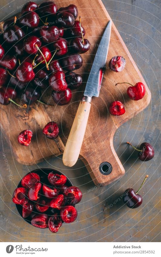 https://www.photocase.com/photos/2854592-cherries-in-a-wooden-cutting-board-black-cherry-photocase-stock-photo-large.jpeg