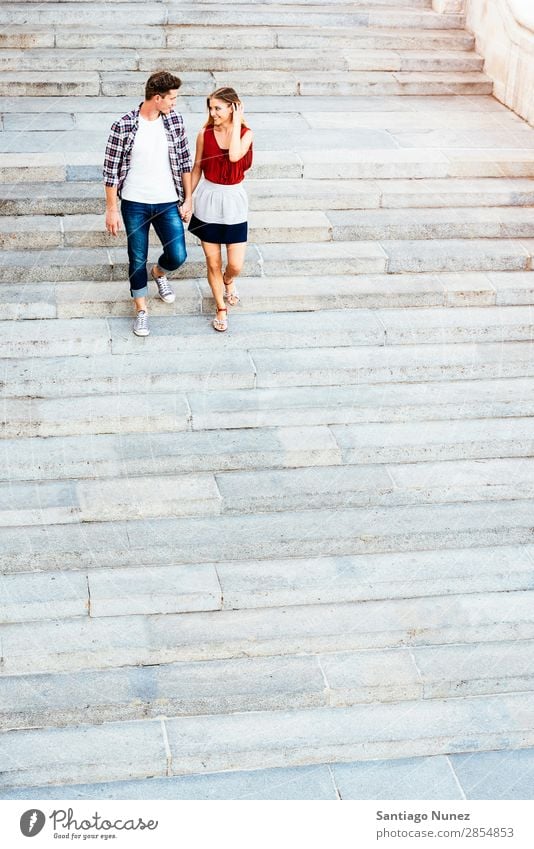 Romantic Young Couple Walking in the City. Relationship Love Youth (Young adults) Happy Laughter Smiling Human being Stairs Going Downward Summer Street Europe
