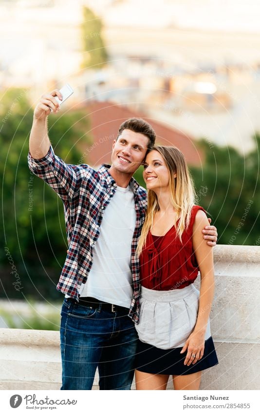 Image Of Happy Cute Young Loving Couple Posing Isolated Over Yellow  Background Take A Selfie By Mobile Phone. Stock Photo, Picture and Royalty  Free Image. Image 110978901.