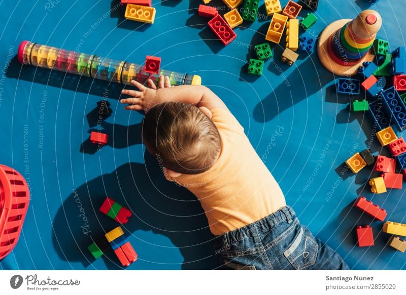 Happy baby playing with toy blocks. Baby Playing childcare Kindergarten School Toys Toddler Boy (child) Small Child LEGO Considerate Story Cute Joy Preschool