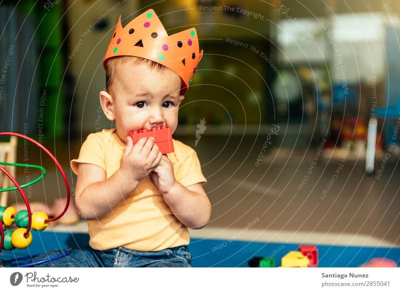 Happy baby playing with toy blocks. Baby Playing childcare Kindergarten School Toys Crown King Bite Toddler Boy (child) Small Child Considerate Story