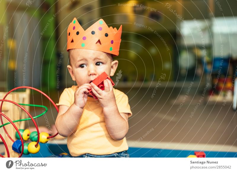 Happy baby playing with toy blocks. Baby Playing childcare Kindergarten School Toys Crown King Bite Toddler Boy (child) Small Child Considerate Story