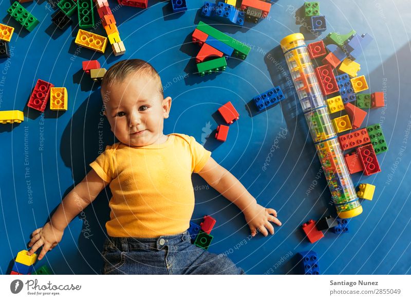 Happy baby playing with toy blocks. Baby Playing childcare Kindergarten School Toys Toddler Boy (child) Small Child Considerate Story Cute Joy Preschool