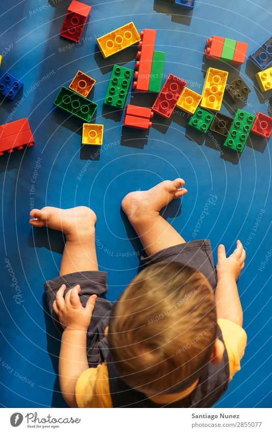 Happy baby playing with toy blocks. Baby Playing childcare Kindergarten School Toys Toddler Boy (child) Small Child Considerate Story Cute Joy Preschool