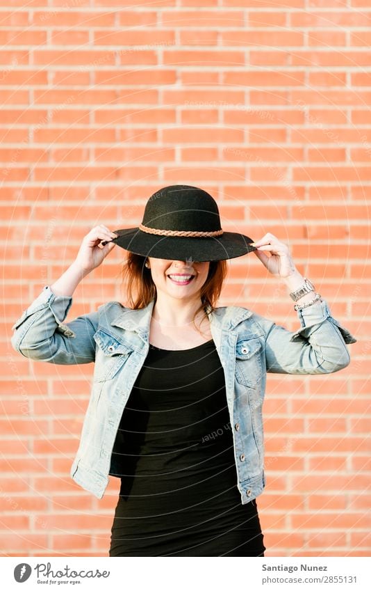 Free Photo  Young pretty hipster woman posing on the street near