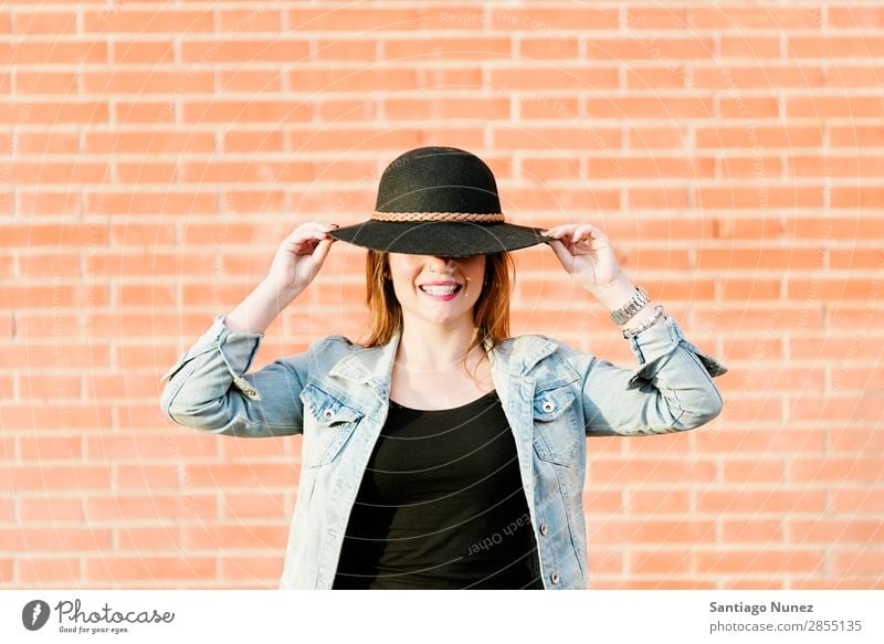 Blonde hipster posing with straw hat against orange brick background. Fashion Wall (building) Girl Hip & trendy Woman Youth (Young adults) Hipster Easygoing