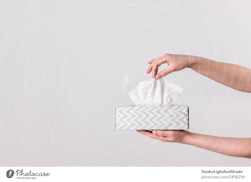 Delicate female hands holding a tissue box Elegant Style Design Health care Illness Allergy Feminine Woman Adults Hand Paper Simple Modern Clean Soft Gray White