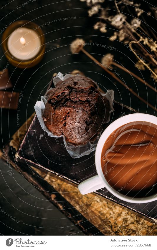Chocolate muffin and mug with hot chocolate Baking Book Cake Candle Hot Chocolate Cupcake Dessert Drinking Food Bird's-eye view handmande Home-made Muffin Mug