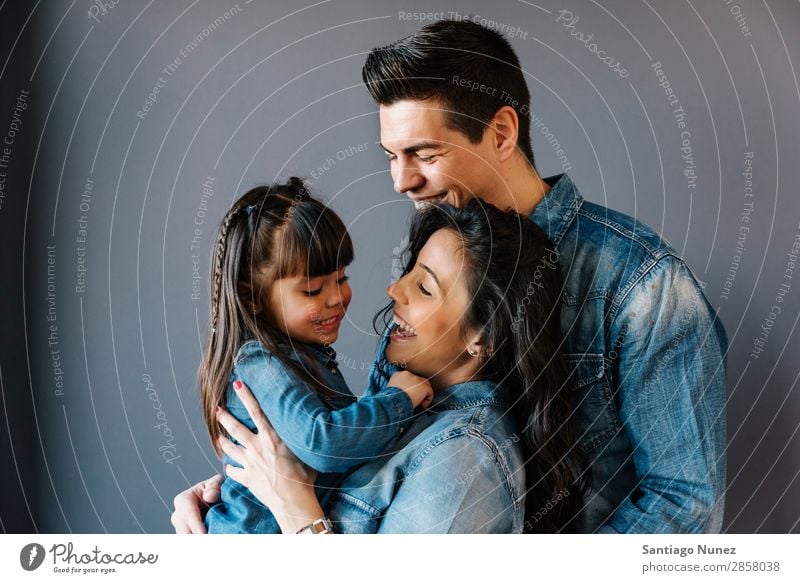 Happy young family with their daughter. Family & Relations Home Youth (Young adults) Child White Human being lifestyle mother Father Embrace Woman Parents