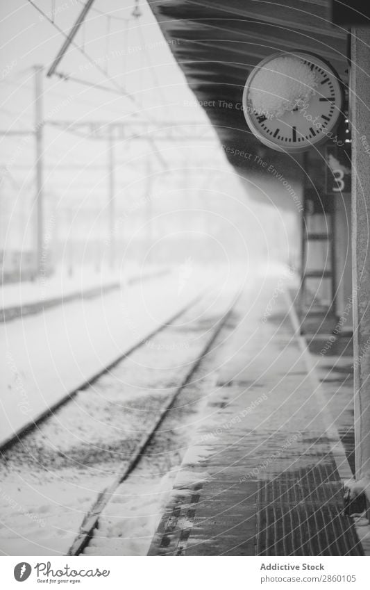 Frozen clock in snowy train station Antique Clock Cold Frost Industrial Exterior shot Platform Railroad Retro Snow snowing Station Train station Transport