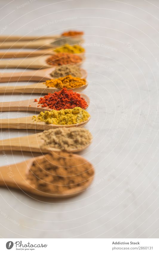 Different spices in wooden spoons Aromatic Background picture Cinnamon Clove condiment Copy Space Coriander Cumin curry Dark Dry flat lay Food Bird's-eye view
