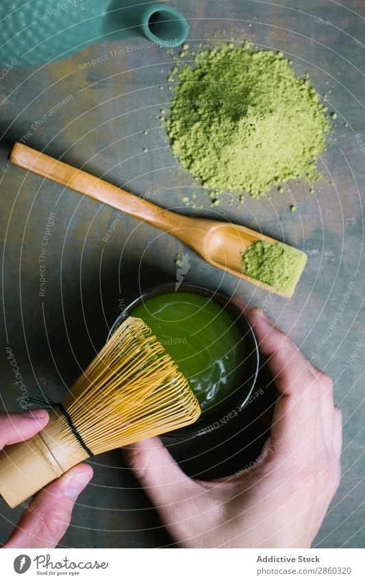 Preparing matcha tea with bamboo whisk Bamboo Beverage brew Green Hand Healthy Japanese Man Powder Scoop Spoon Tea Beater