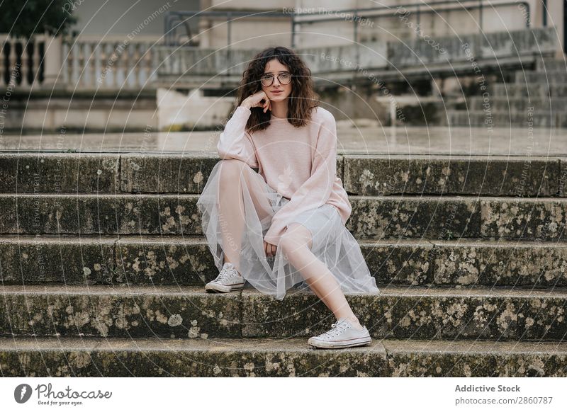 Stylish woman in skirt sitting on steps Woman Style Steps Skirt Person wearing glasses Sneakers pretty Dress Hip & trendy romantic Veil Brunette Wet Stairs