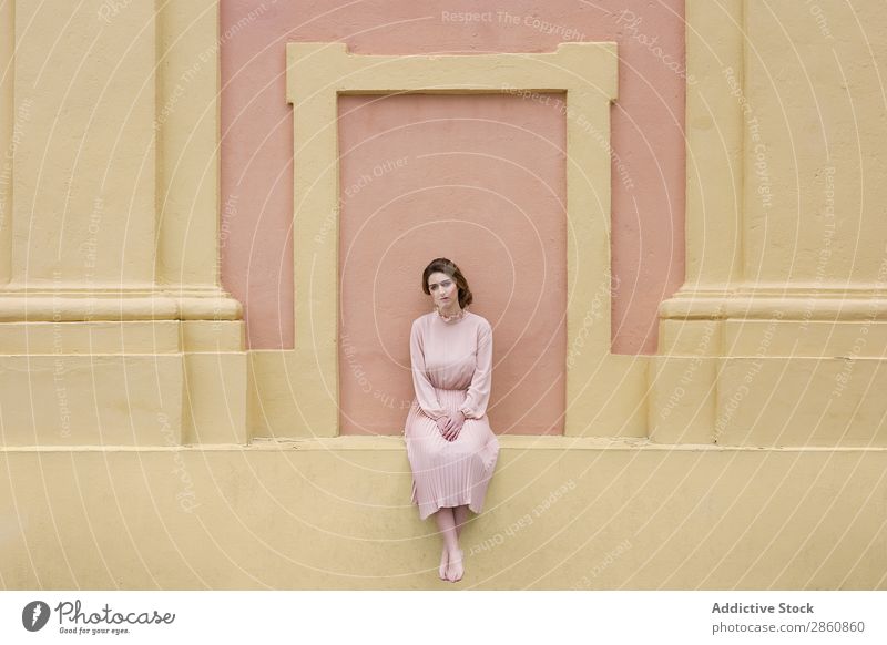 Woman in pink dress posing at wall pretty Youth (Young adults) Dress Vintage Pink Wall (building) Posture Sit Beautiful Attractive Human being