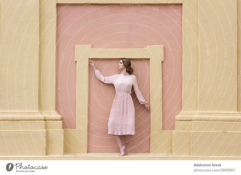 Woman in pink dress posing at wall pretty Youth (Young adults) Dress Vintage Pink Wall (building) Posture Stand Sit Beautiful Attractive Human being