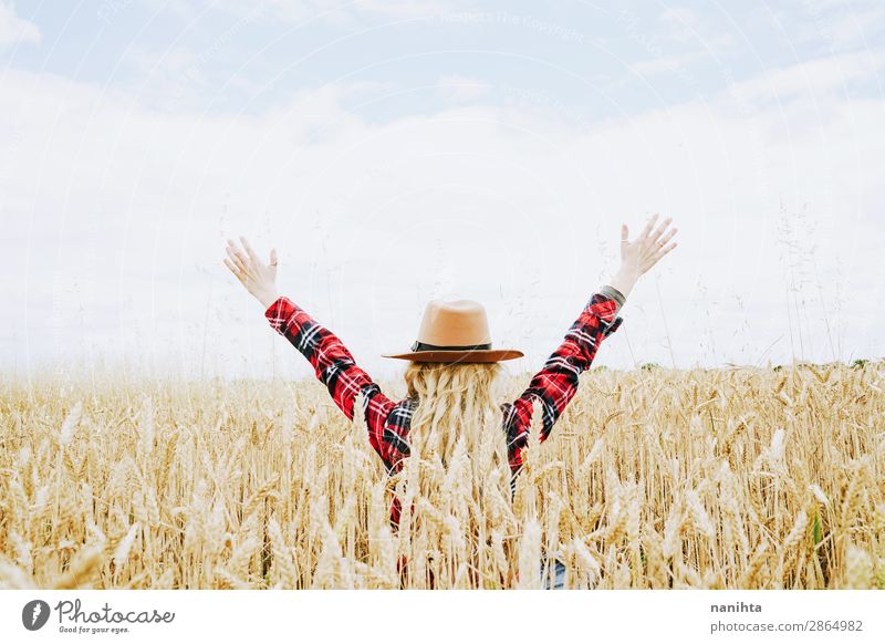 Young cowgirl in a field of cereals Lifestyle Joy Beautiful Wellness Well-being Freedom Summer Agriculture Forestry Industry Human being Feminine Young woman