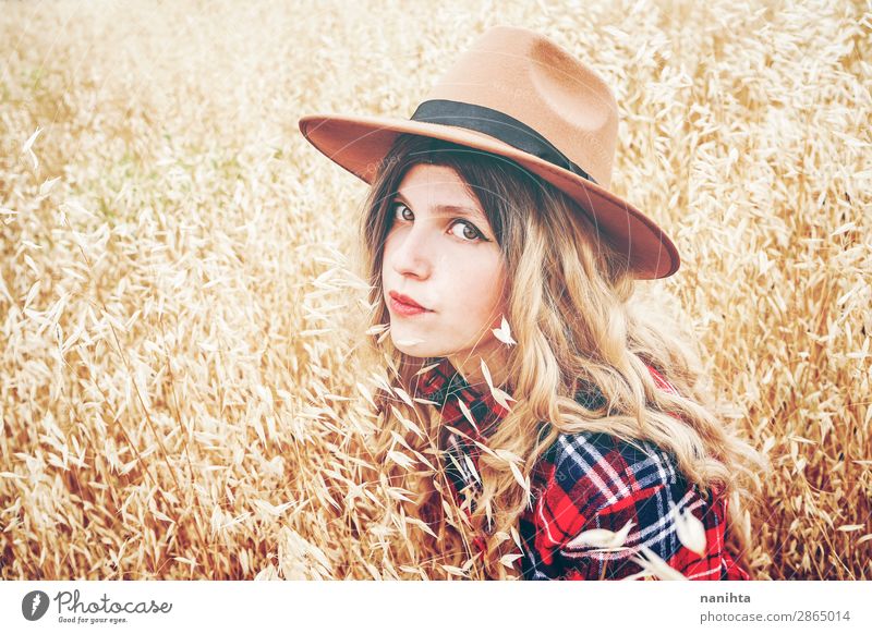 Young cowgirl in a field of cereals Lifestyle Style Beautiful Wellness Well-being Senses Freedom Summer Industry Human being Feminine Young woman
