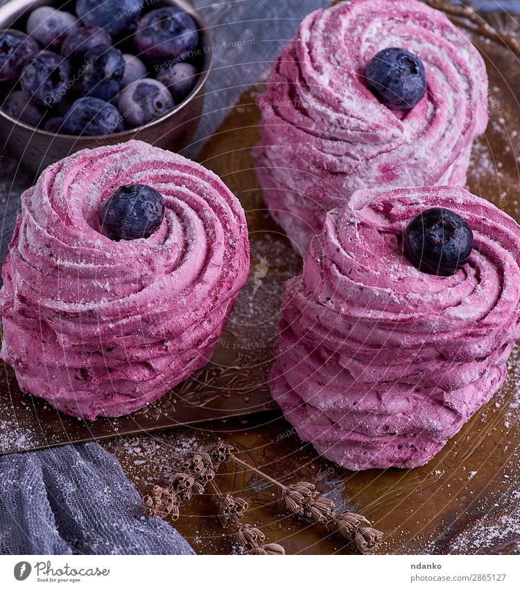 round pieces of marshmallow with blueberries Fruit Dessert Beautiful Table Eating Natural Above Soft Blue Pink Colour Airy background Berries Blueberry cake