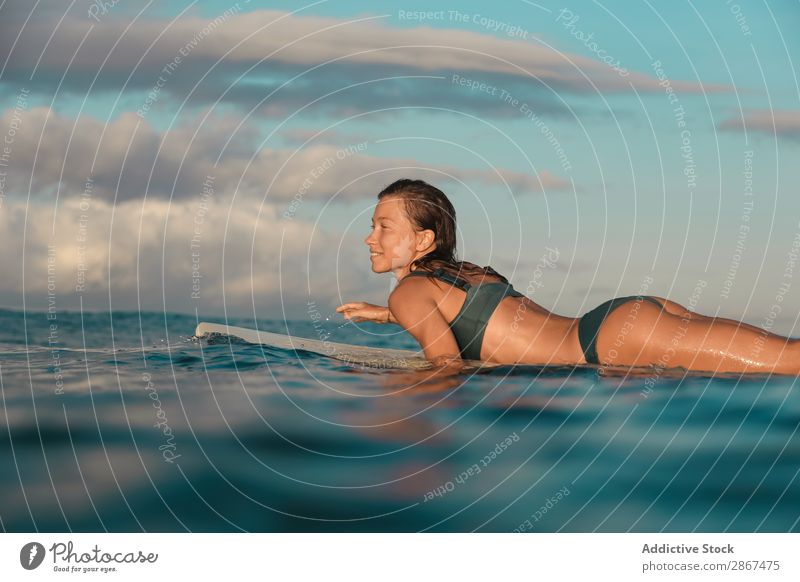 woman on surf board floating on water Woman Surfboard Water Sports Bali Indonesia Surfing Wave Floating Blue Smiling Ocean Surface Heaven Cheerful Balance