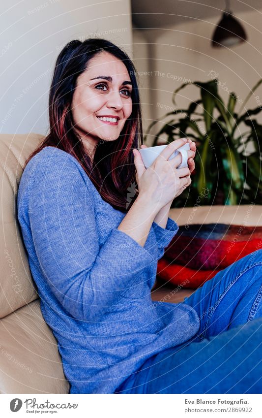 young caucasian woman having coffee at home Breakfast Beverage Coffee Tea Lifestyle Happy Leisure and hobbies Sofa Human being Feminine Young woman