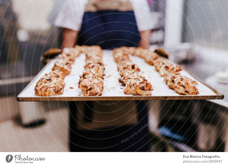 woman holding holding rack of sweets in bakery Bread Happy Kitchen Restaurant School Work and employment Profession Camera Feminine Woman Adults 1 Human being