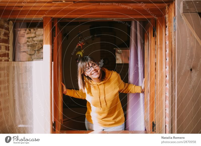 a young woman in a yellow sweatshirt opens the window Lifestyle Style Joy Happy Beautiful Relaxation Leisure and hobbies Vacation & Travel Winter vacation