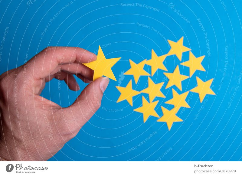 Select stars Economy Business Career Success Man Adults Hand Fingers Stars Paper Sign Utilize To hold on Communicate Together Blue Yellow Agreed Loyal