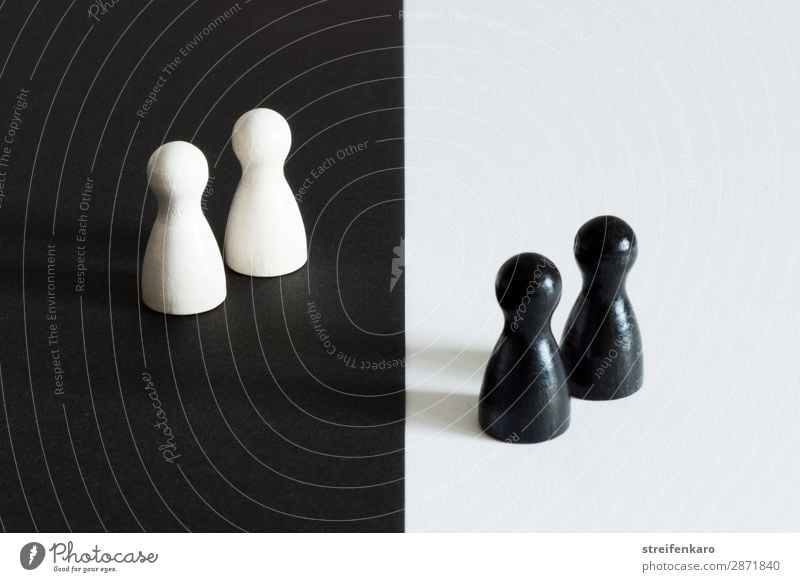 Two white game pieces on a black background are facing two black game pieces on a white background Piece Group Toys Wood Sign Observe Stand Curiosity Black