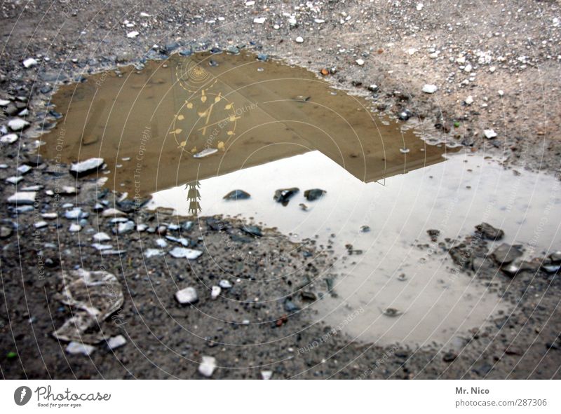 happy birthday, photocase | everything has its time Environment Earth Climate Bad weather Time Puddle Clock Building Cold Wet Gray Pavement Reflection