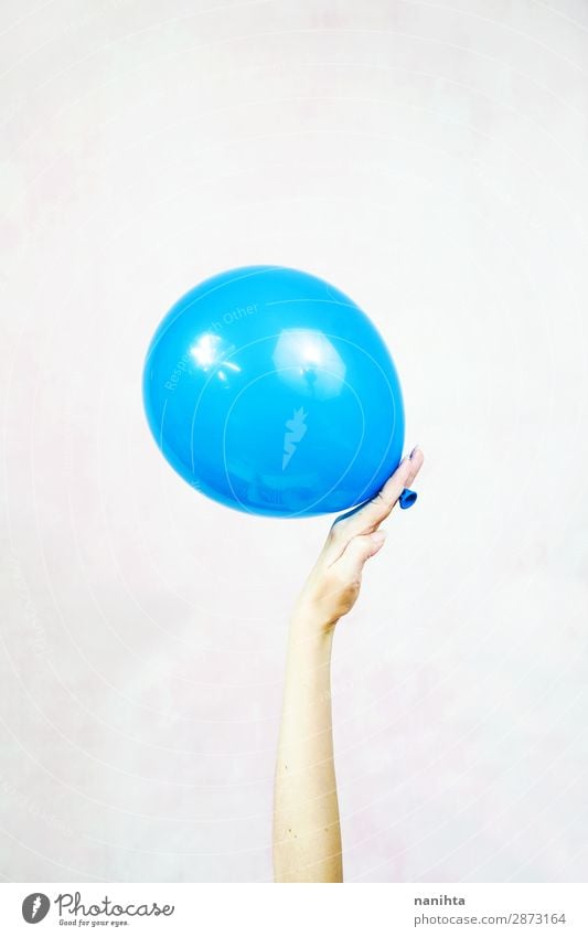 Hand holding a balloon Joy Contentment Leisure and hobbies Playing Decoration Feasts & Celebrations Birthday Child Closing time Woman Adults Infancy Arm Balloon