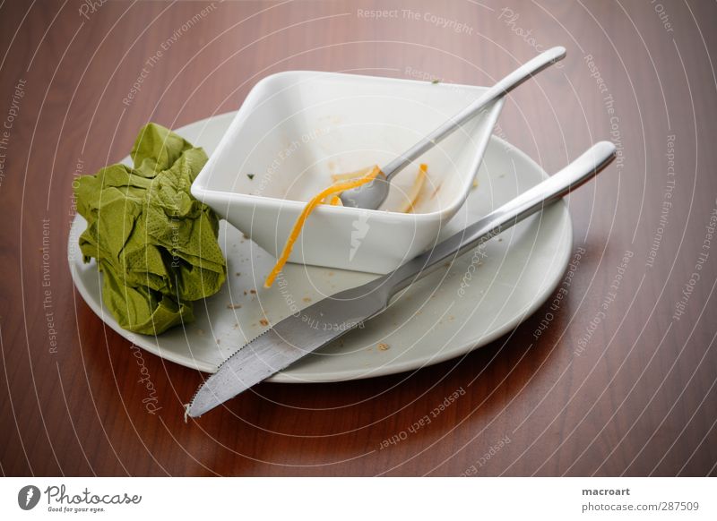 plate and bowl with food leftovers Plate Bowl Leftovers Remainder Dish Eating Knives Fork Napkin Green Cloth Spoon Cheese Wooden table Brown Knot Food Nutrition