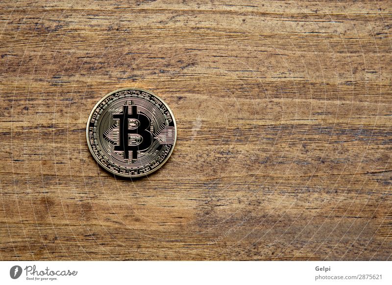 Golden Bitcoin Coin Close Up Shopping Money Economy Financial Industry Financial institution Business Internet Wood Metal Paying White Electronic Cryptocurrency