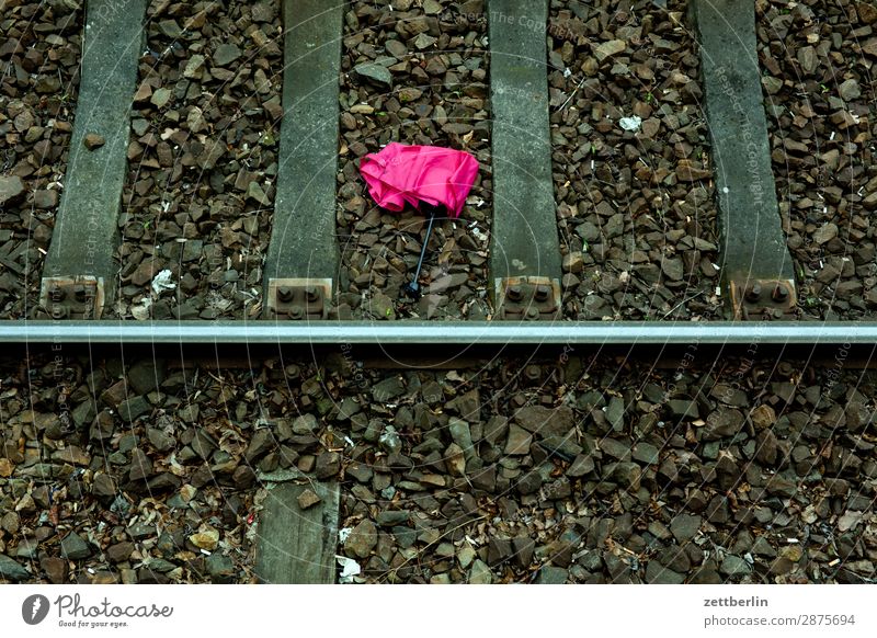 Umbrella in track bed Umbrellas & Shades Lose Doomed Lie Discovery Discovery site Train station Berlin Railroad Deserted Public transit Commuter trains
