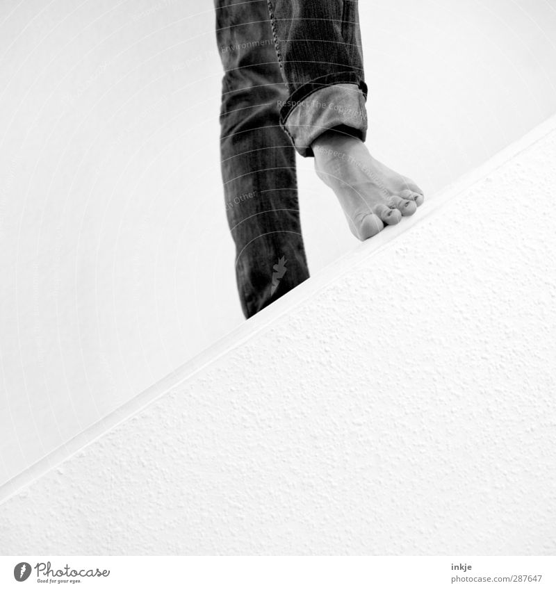 Step in between. It's got a hand and a foot. Feet 1 Human being Wall (barrier) Wall (building) Stairs Jeans Going Stand Simple Beginning Perspective