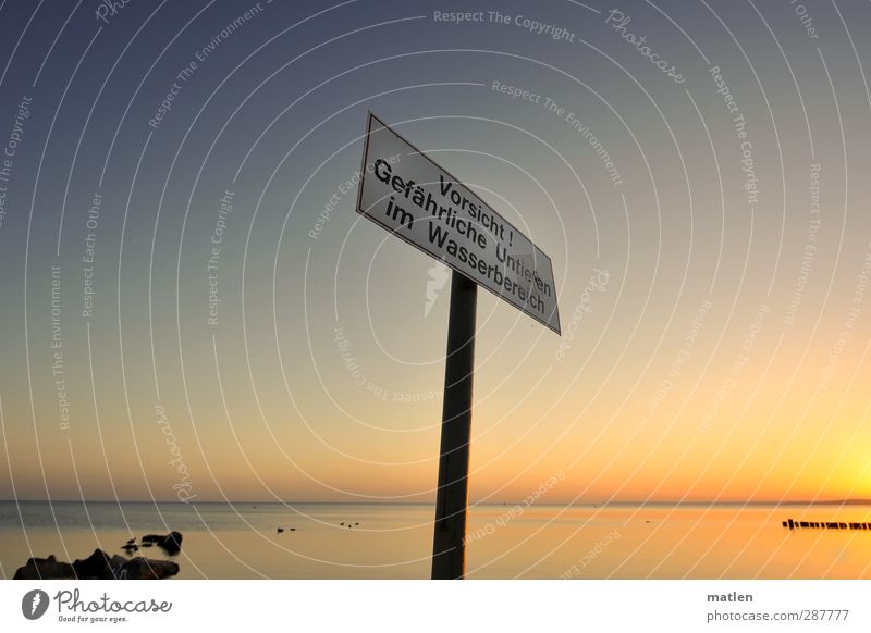 Where else;-)? Landscape Sky Cloudless sky Horizon Beautiful weather Rock Coast Ocean Metal Signs and labeling Signage Warning sign Blue Gold Competent groynes