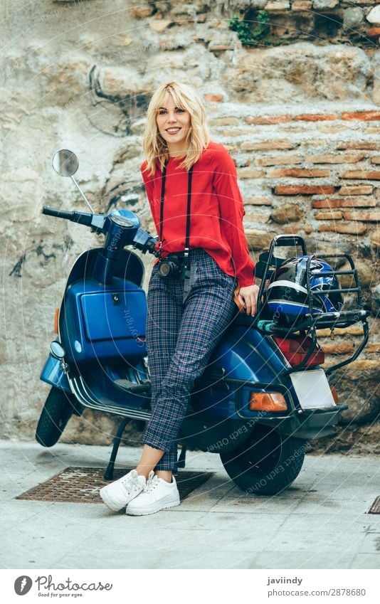 Woman sitting on an old blue scooter wearing red clothes. Lifestyle Style Happy Beautiful Hair and hairstyles Leisure and hobbies Vacation & Travel Tourism
