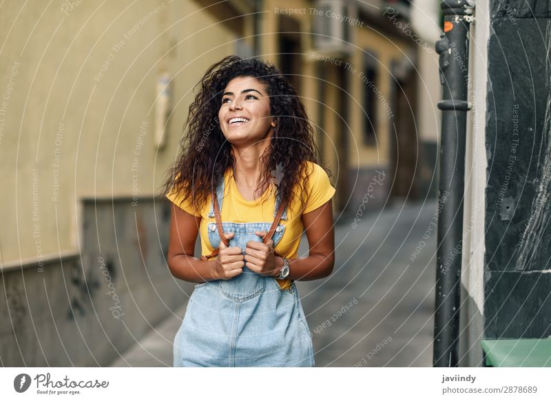 Young North African woman with black curly hairstyle outdoors. Lifestyle Style Happy Beautiful Hair and hairstyles Face Tourism Human being Feminine Young woman