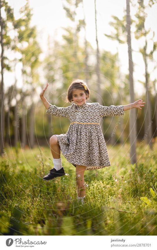 Little girl walking in nature field wearing beautiful dress Lifestyle Joy Happy Beautiful Playing Summer Child Human being Baby Girl Woman Adults Infancy 1