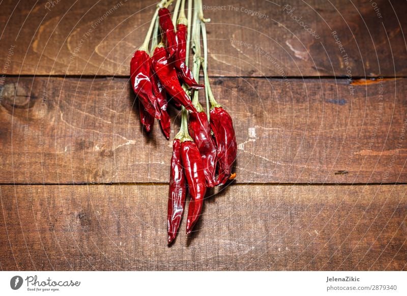 Red hot chili peppers on a wooden background Food Vegetable Herbs and spices Nutrition Eating Organic produce Vegetarian diet Healthy Eating Table Kitchen