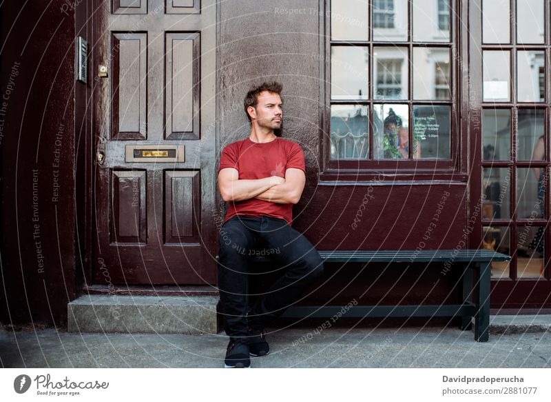 Man sitting in a bench on a beautiful maroon background Caucasian Building Youth (Young adults) Architecture Vintage Notting Hill decor Street Sit Summer