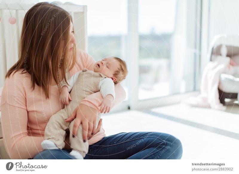 Young Mother holding newborn baby Eating Happy Beautiful Child Baby Woman Adults Parents Family & Relations Infancy Arm Feeding Love Small White Protection